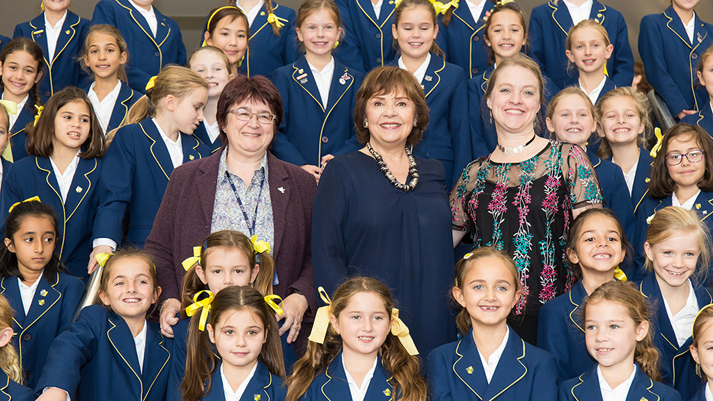 Dana with the 55-strong choir from Notre Dame School Cobham