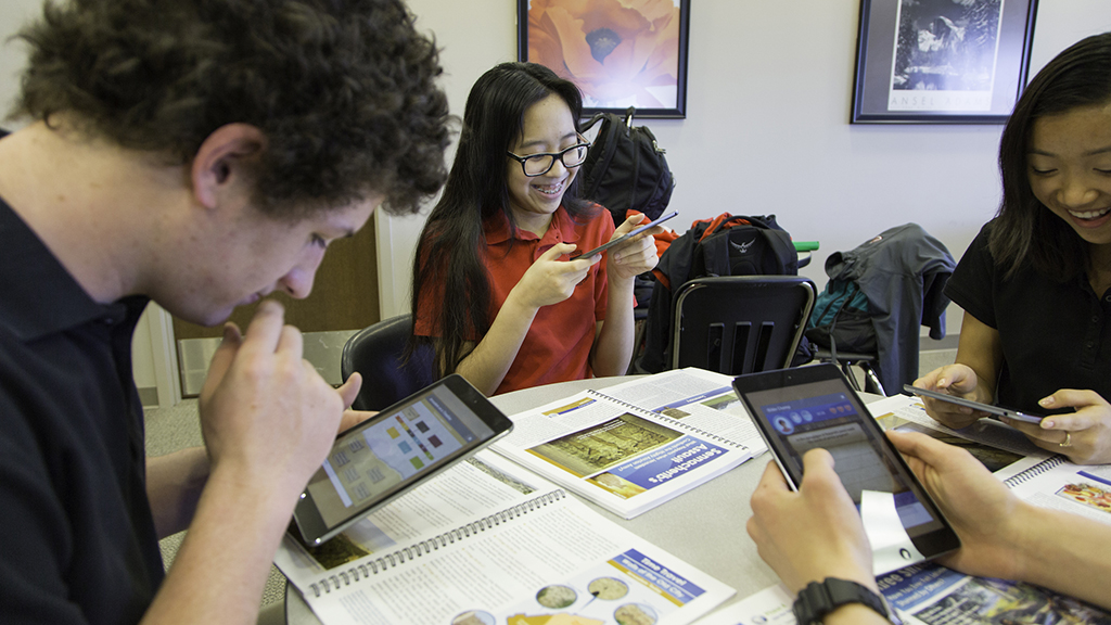 Photo of school students with RE materials on iPads