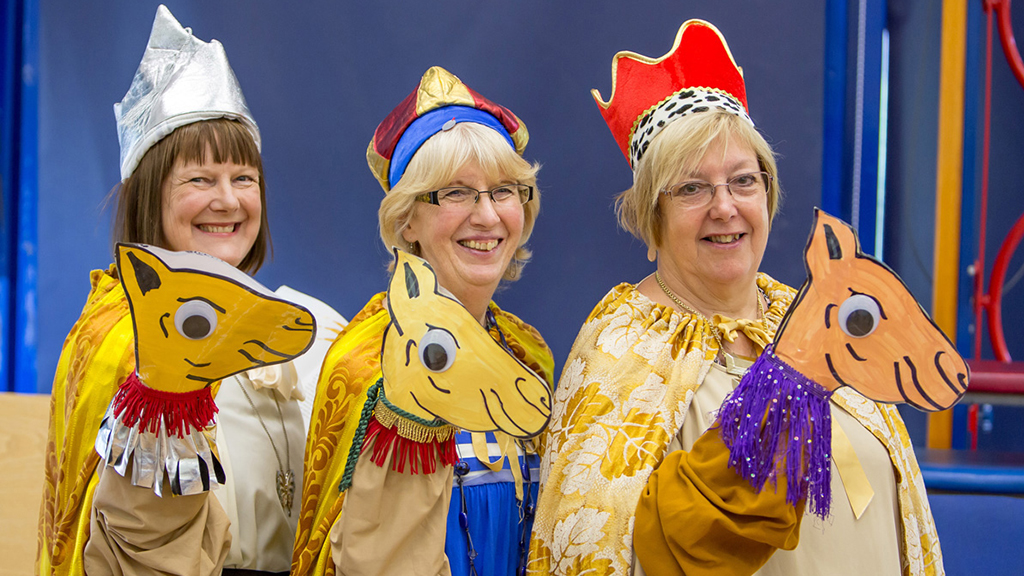 Photo of Open the Book team members dressed as the three wise men