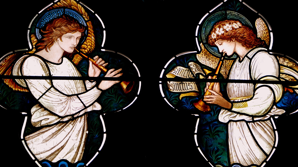 Photo of stained glass angels playing trumpets