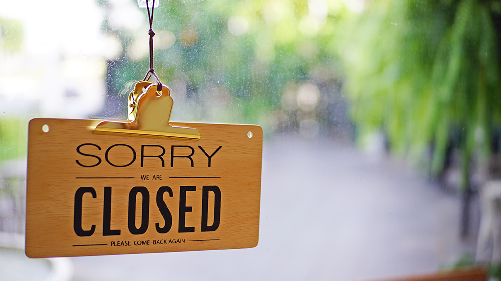 Photo of shop sign saying sorry we are closed