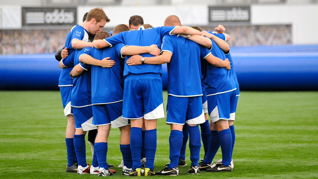 photo of football prayer huddle