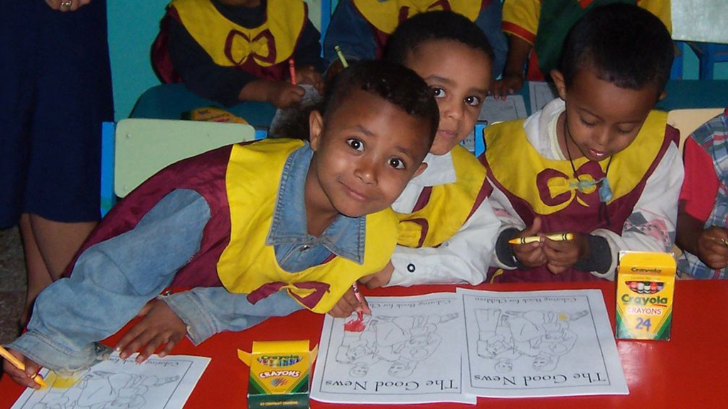 Photo of kids with colouring books