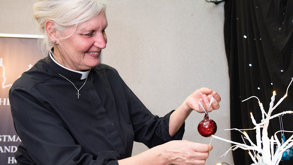 Photo of Ros Pollock with a Bethlehem Bauble