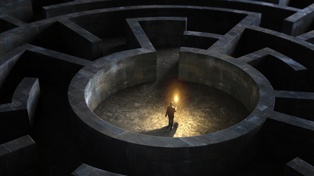 Illustration of man with candle at centre of a dark maze